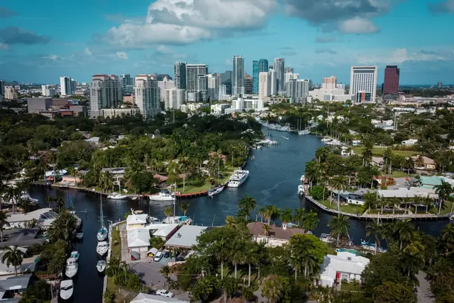Fort Lauderdale skyline over a canal with boats