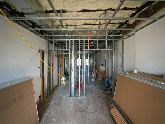 An interior stripped to metal studs during restoration work
